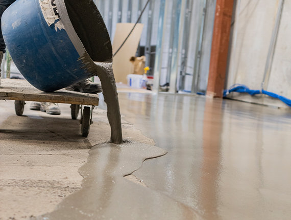 BNE using self-levelling concrete overlay to repair uneven industrial concrete floor